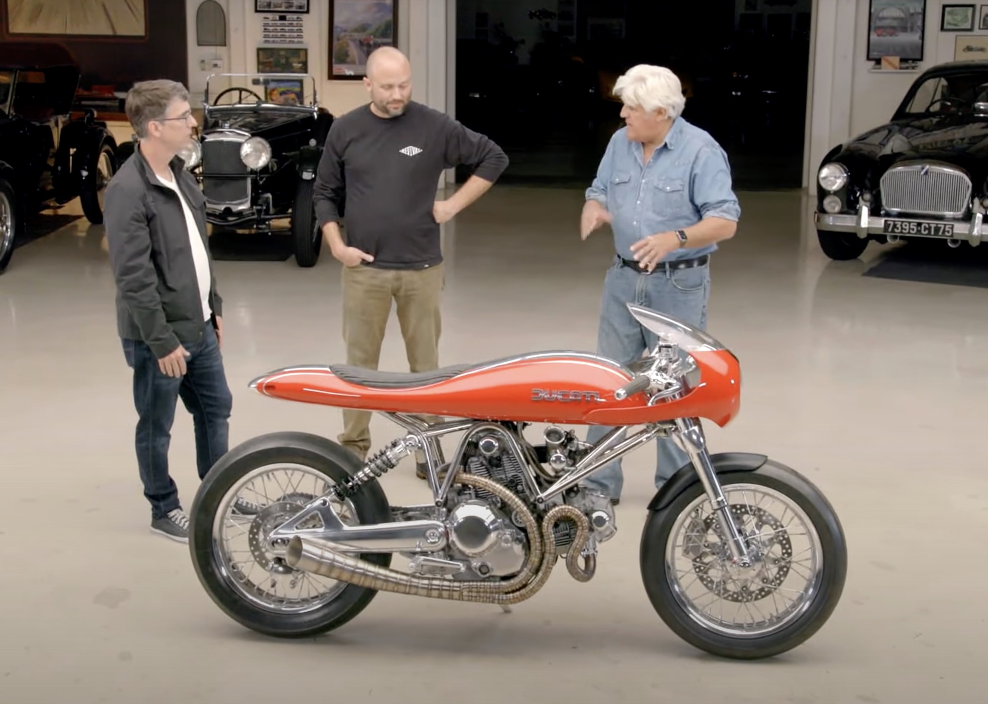 The Revival Cycles FUSE, with the bike’s creator (Alan Stulberg, founder of Revival) and owner (Edward Boyd) next to Jay Leno from 'Jay Leno's Garage.' Media sourced from Youtube.